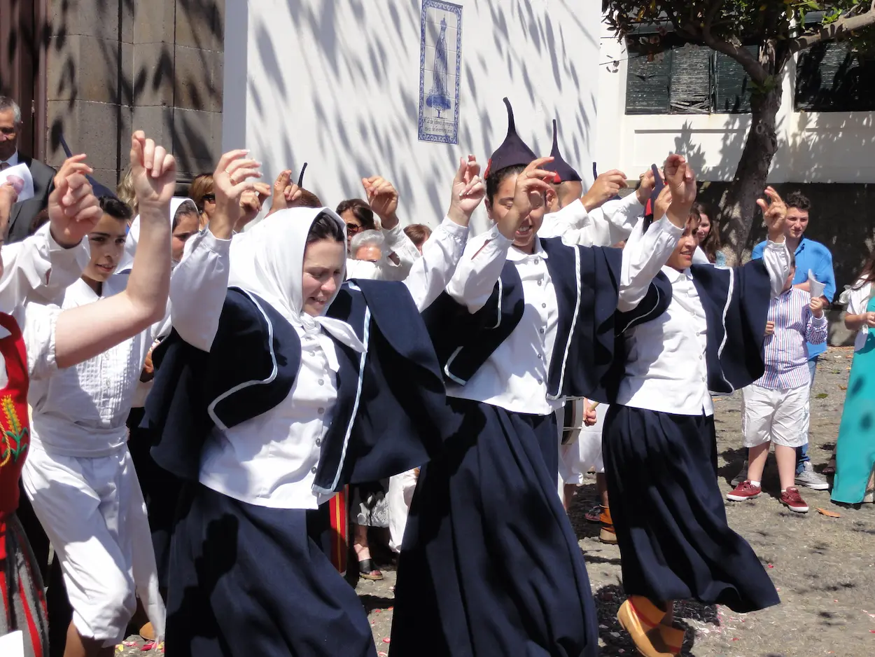 Madeira traditional folklore group dancing Bailinho outside of a church