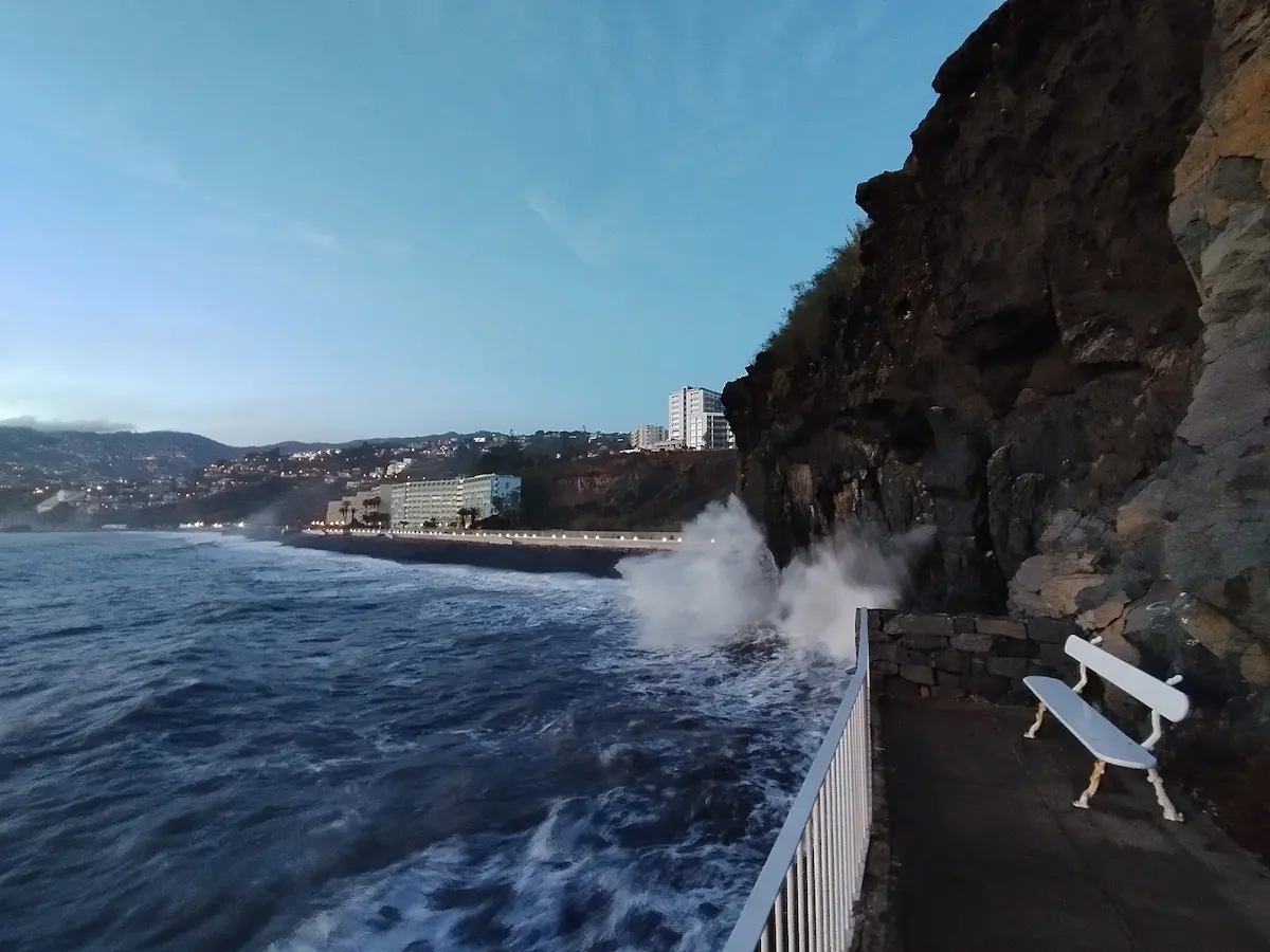 Waves crashing into a cliff in Praia Formosa, Funchal - View from Doca do Cavacas